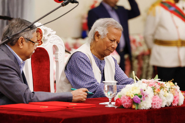 Nobel laureate Muhammad Yunus signs the oath book as the country’s head of the interim government in Bangladesh at the Bangabhaban, in Dhaka, Bangladesh, pn August 8, 2024. (Photo by Mohammad Ponir Hossain/Reuters)