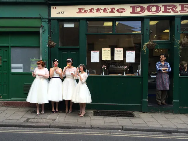 “Ladies in waiting”. While exploring Burough Market in London, I was delighted to come across four lovely young women dressed in vintage white dresses, eating ice cream as the local shopkeeper looked on. Are they brides? Or bridesmaids. I don't know, but they are obviously enjoying a very special day. Photo location: Burough Market, London, England. (Photo and caption by Susie Stern/National Geographic Photo Contest)