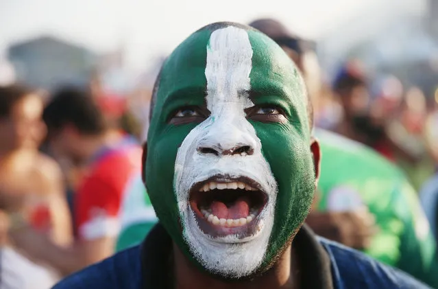 A Nigerian soccer fan looks on as his team plays against Iran as he watches on a giant screen at the FIFA World Cup Fan Fest on Copacabana beach on June 16, 2014 in Rio de Janeiro, Brazil. The teams are playing on the fifth day of the World Cup tournament. (Photo by Joe Raedle/Getty Images)