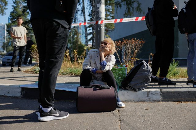 Local residents gather outside a damaged multi-storey building following an alleged Ukrainian drone attack, in Ramenskoye in the Moscow region, Russia on September 10, 2024. (Photo by Maxim Shemetov/Reuters)