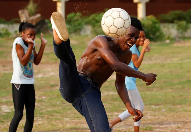 Youths practice their soccer skills at a park ahead of the African Nations Cup soccer final in Libreville, Gabon, February 2, 2017. (Photo by Mike Hutchings/Reuters)