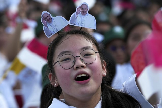 A girl reacts as Pope Francis arrives at Madya Stadium in Jakarta, Indonesia, Thursday, September 5, 2024. (Photo by Tatan Syuflana/AP Photo)