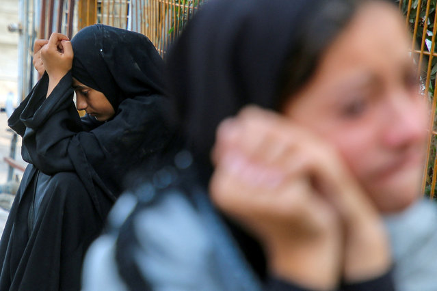 Relatives of Palestinians from Abu Taima family, who were killed in an Israeli strike, grieve during their funeral, amid the ongoing Israel-Hamas conflict, at Nasser hospital in Khan Younis, in the southern Gaza Strip on October 15, 2024. (Photo by Hatem Khaled/Reuters)