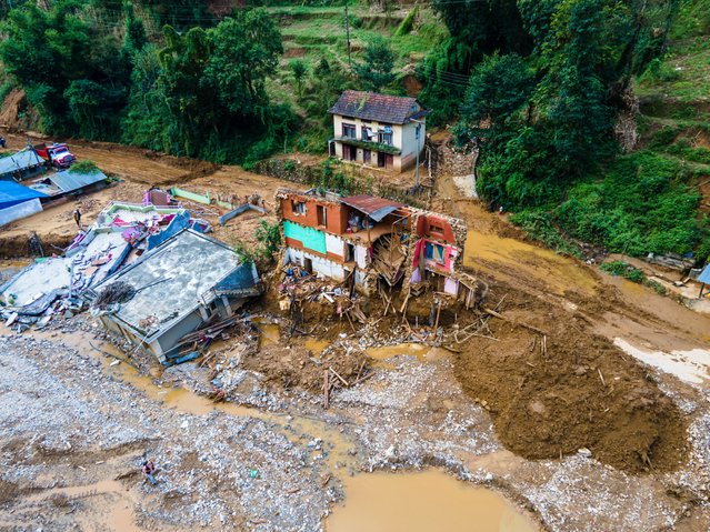 The aerial view shows the flood-affected areas of Patikharka, Kavrepalanchok District, Nepal, on October 3, 2024. Homes are severely damaged, with many families forced to be homeless. (Photo by Ambir Tolang/NurPhoto/Rex Features/Shutterstock)