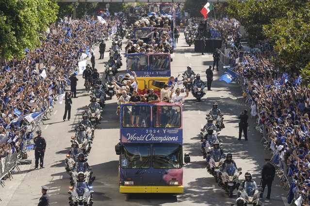 Los Angeles Dodgers players, coaches and ownership group are paraded on buses during the baseball team's World Series championship parade Friday, November 1, 2024, in Los Angeles. (Photo by Damian Dovarganes/AP Photo)