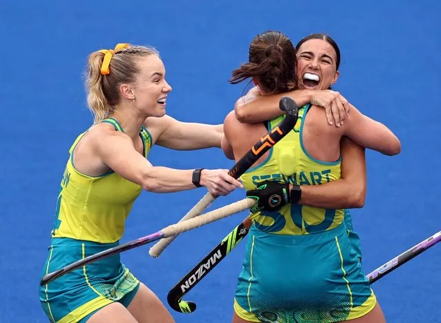 Shanea Tonkin of Team Australia celebrates with team mates after scoring their sides first goal during Women - Pool B match between Australia and Scotland on day six of the Birmingham 2022 Commonwealth Games at University of Birmingham Hockey & Squash Centre on August 03, 2022 in Birmingham, England. (Photo by Stoyan Nenov/Reuters)
