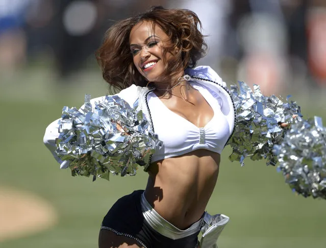 September 15, 2013; Oakland, CA, USA; Oakland Raiders cheerleader Victoria Braga perform during the game against the Jacksonville Jaguars at O.co Coliseum. (Photo by Kirby Lee/USA TODAY Sports)