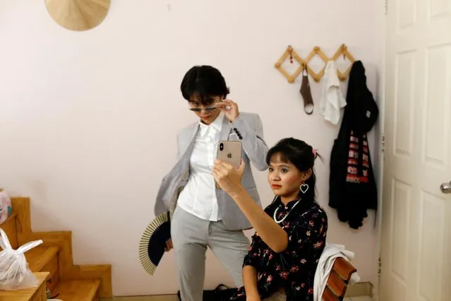 Nhu (L), 23, and Thanh, 21, take pictures for their Instagram and Tik Tok pages as they stay home during the outbreak of the coronavirus diease (COVID-19), in Ho Chi Minh, Vietnam, April 5, 2020. (Photo by Yen Duong/Reuters)