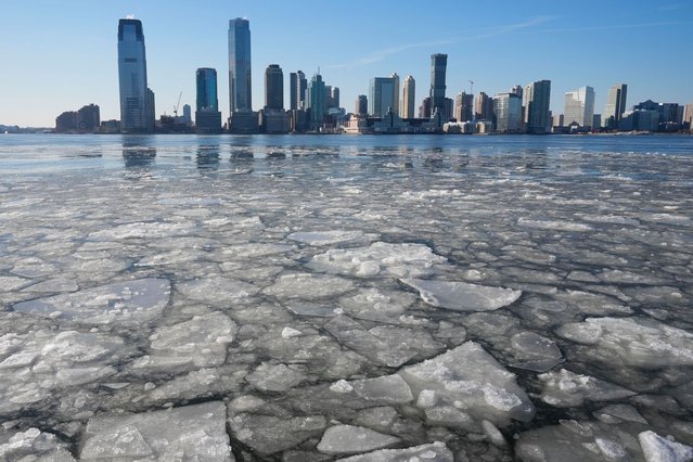 New Jersey is seen behind ice floating on the Hudson River in New York, Wednesday, January 22, 2025. (Photo by Seth Wenig/AP Photo)