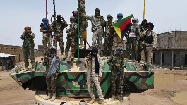 Fighters for The National Movement for the Liberation of Azawad (MNLA) pose for a picture on August 28, 2022. One of Mali’s main armed groups, The National Movement for the Liberation of Azawad (MNLA), held a congress at the end of August 2022 in Kidal, to commit to the merger of all armed ex-rebel groups belonging to the Coordination of Azawad Movements (CMA), who signed the peace agreement in 2015. (Photo by Souleymane Ag Anara/AFP Photo)
