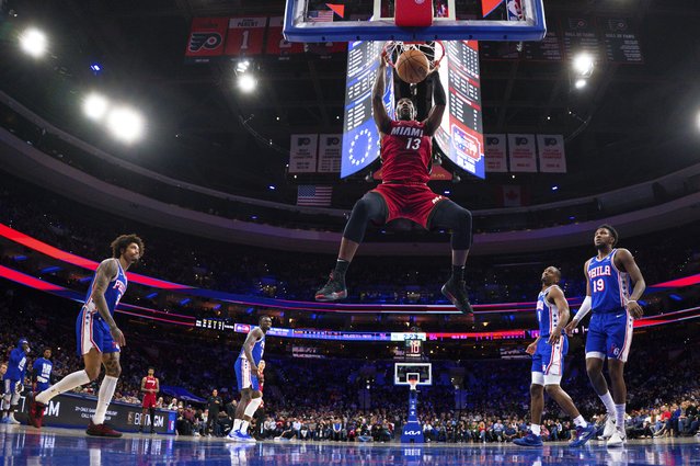 Miami Heat's Bam Adebayo, center, dunks the ball as the Phialdlepiha 76ers look on during the second half of an NBA basketball game, Wednesday, February 5, 2025, in Philadelphia. Heat won 108-101. (Photo by Chris Szagola/AP Photo)