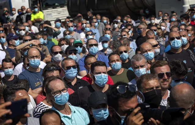 Nissan workers gather during a protest in front of the Nissan factory in Barcelona, Spain, Thursday, May 28, 2020. Japanese carmaker Nissan Motor Co. has decided to close its manufacturing plans in the northeastern Catalonia region, resulting in the loss of some 3,000 direct jobs. (Photo by Emilio Morenatti/AP Photo)