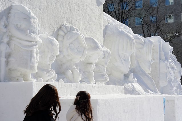 Snow sculptures are displayed during the 75th Sapporo Snow Festival on February 04, 2025 in Sapporo, Japan. The Sapporo Snow Festival, held annually in early February, is one of Japan's most iconic winter events, attracting over two million visitors to marvel at its stunning snow and ice sculptures across three main venues: Odori Park, Susukino, and Tsudome. The festival, which began in 1950 with six snow sculptures created by local students, has grown into a global spectacle featuring large-scale snow art, illuminated displays, and various winter activities. (Photo by Christopher Jue/Getty Images)