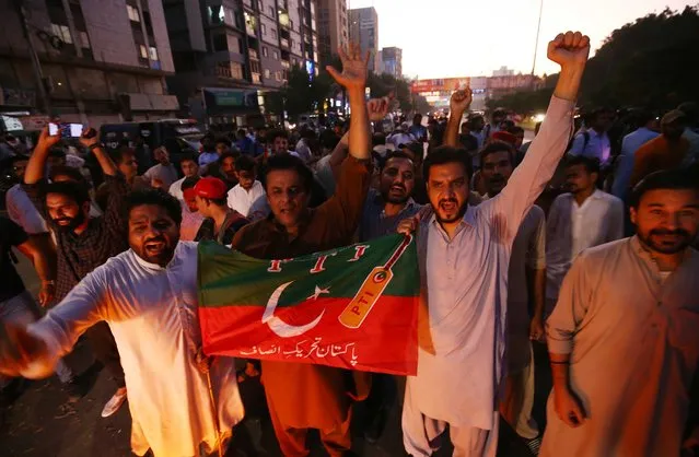 Supporters of former prime minister Imran Khan shout slogans during a protest after Khan suffered bullet injuries near Wazirabad, in Karachi, Pakistan, 03 November 2022. Pakistan's former prime minister Imran Khan suffered a gunshot wound on 03 November after an unidentified attacker opened fire on a crowded rally led by the politician, according to party officials. The former prime minister is leading a long march from Lahore to the capital Islamabad to pressure the government for early elections in the country. (Photo by Shahzaib Akber/EPA/EFE/Rex Features/Shutterstock)