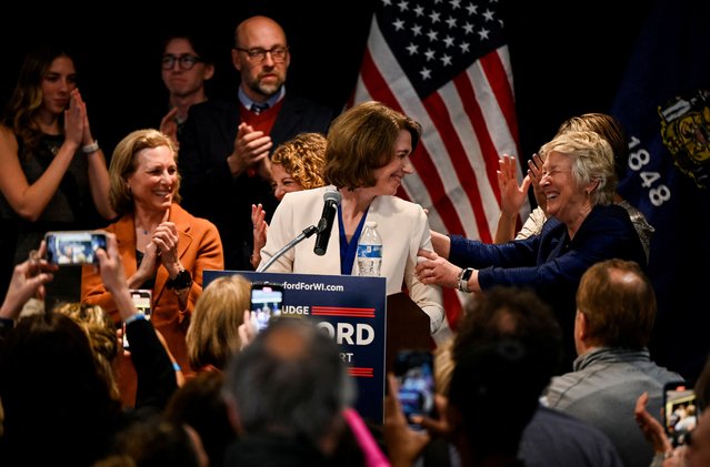 Democrat-backed Wisconsin Supreme Court candidate Judge Susan Crawford reacts alongside Wisconsin Supreme Court Judge Ann Walsh Bradley as she addresses supporters after voters elected her to the state Supreme Court, at her election night headquarters in Madison, Wisconsin, U.S. April 1, 2025. (Photo by Vincent Alban/Reuters)