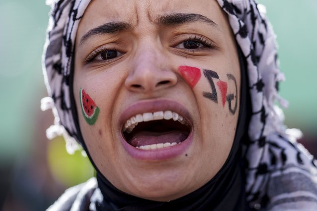 A woman shouts slogans during a protest in support of Palestinians and calling for an immediate ceasefire in Gaza in Madrid, Spain, Saturday, January 20, 2024. (Photo by Manu Fernandez/AP Photo)