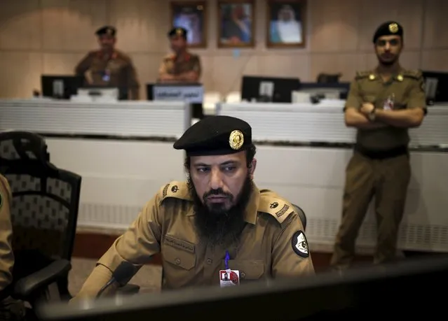 Saudi policemen look at monitor screens showing footage from cameras set up around the holy places, during a tour for journalists, on the second day of Eid al-Adha in Mina near the holy city of Mecca  September 25, 2015. (Photo by Ahmad Masood/Reuters)