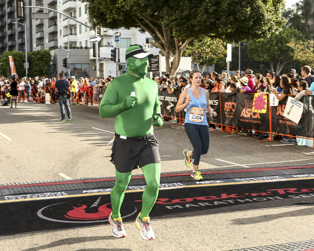 General view of a runner preparing to cross the finish line at the Rock 'n' Roll Los Angeles Halloween Half-Marathon and 5K benefitting the ASPCA on October 26, 2014 in Los Angeles, California. (Photo by Rich Polk/Getty Images for CGI)