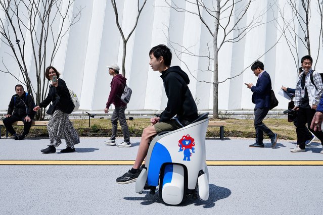 A visitor tries experiencing to maneuver UNI-ONE electric mobility devices built by Honda, dubbing the ride as “hands-free personal mobility devices”, during the Expo 2025 in Osaka, western Japan, Monday, April 14, 2025. (Photo by Hiro Komae/AP Photo)
