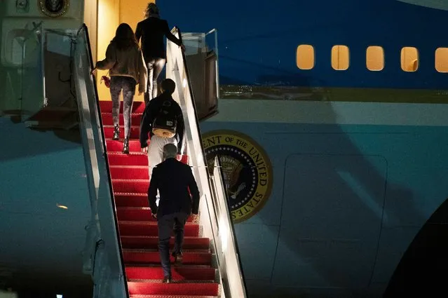 President Joe Biden, bottom, first lady Jill Biden, top, and their grandchildren Natalie and Robert, board Air Force One at Andrews Air Force Base, Md., Tuesday, December 27, 2022. Biden and his family are traveling to St Croix, U.S. Virgin Islands to celebrate the New Year. (Photo by Cliff Owen/AP Photo)