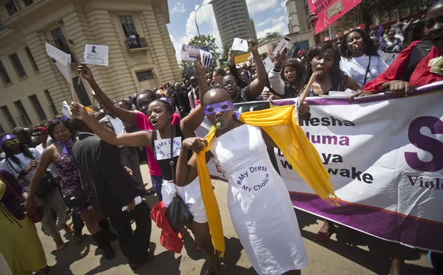 Kenyan women protest for the right to wear whichever clothes they want, at a demonstration in downtown Nairobi, Kenya Monday, November 17, 2014. (Photo by Ben Curtis/AP Photo)
