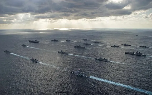 U.S. Navy and Japan Maritime Self-Defense Force ships steam in formation during their military manoeuvre exercise known as Keen Sword 15 in the sea south of Japan, in this November 19, 2014 handout provided by the U.S. Navy. (Photo by Mass Communication Specialist 3rd Class Chris Cavagnaro/Reuters/U.S. Navy)