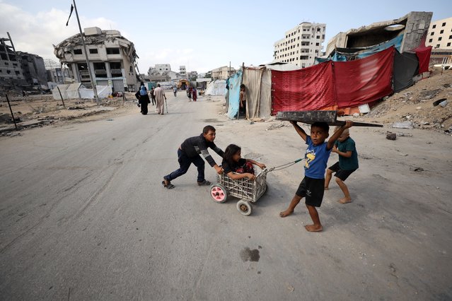 Palestinian families continue their daily lives under harsh living conditions with limited access to water, food, and basic supplies as they are forced to flee toward the central parts of the Gaza Strip following Israel's ongoing ground and airstrikes in Gaza City, Gaza on September 22, 2025. Palestinians in Gaza . (Photo by Khames Alrefi/Anadolu via Getty Images)