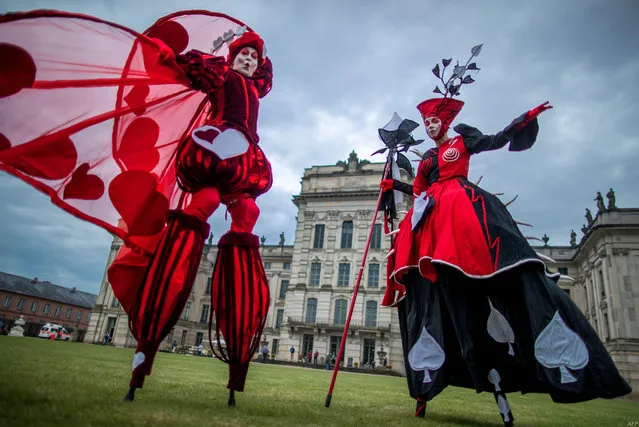 Dancers of the Art Tremendo dance company perform in front of the Ludwigslust's castle, northern Germany on April 13, 2018, during an event to promote the “Small festival in a big park” festival to be held on August 10 and 11. (Photo by Jens Büttner/AFP Photo/DPA)