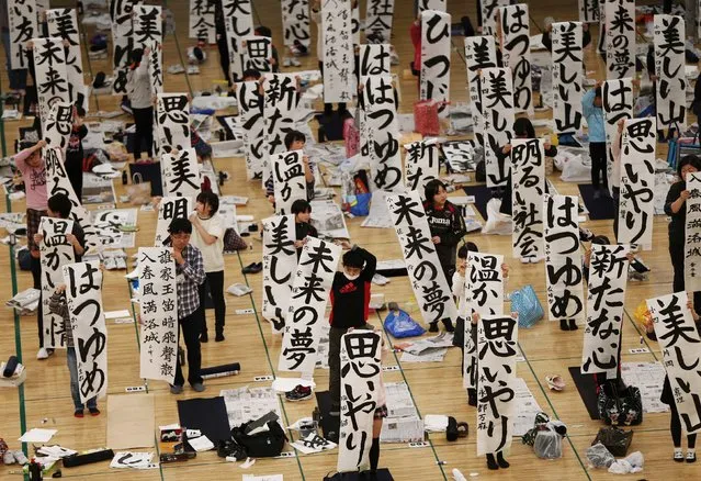 Participants show off their writings at a new year calligraphy contest in Tokyo January 5, 2015. (Photo by Issei Kato/Reuters)