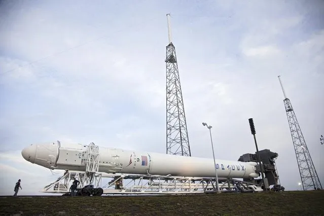 A SpaceX Falcon 9 rocket is seen at the launch site at Cape Canaveral, Florida, in this NASA handout picture released January 9, 2015. SpaceX plans to launch the rocket on Saturday, then attempt to land the discarded booster on a platform in the ocean, according to officials. (Photo by Reuters/NASA)