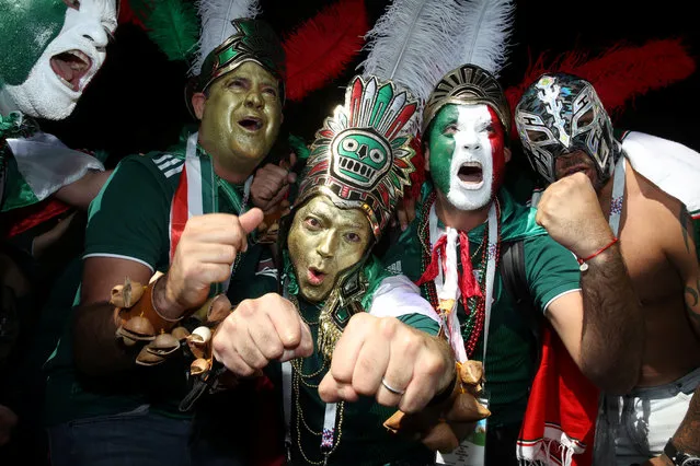 Mexico's national football team fans celebrate their team's victory outside the Kremlin on June 17, 2018, in Moscow, on the sideline of the Russia 2018 World Cup football tournament. (Photo by Carl Recine/Reuters)