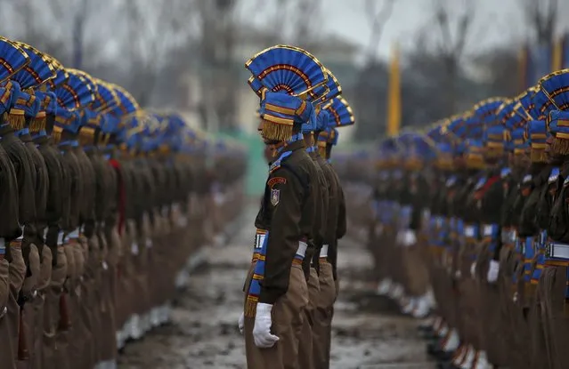 India's Central Reserve Police Force (CRPF) personnel take part in a passing out parade in Humhama, on the outskirts of Srinagar December 11, 2015. A total of 648 new policemen were formally inducted into the force after they completed their training courses and will be deployed in different parts of India, according to a CRPF media release. (Photo by Danish Ismail/Reuters)