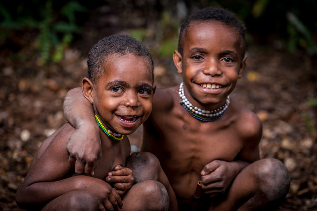 Young children from Dani tribe smiling in, Western New Guinea, Indonesia, August 2016. (Photo by Teh Han Lin/Barcroft Images)