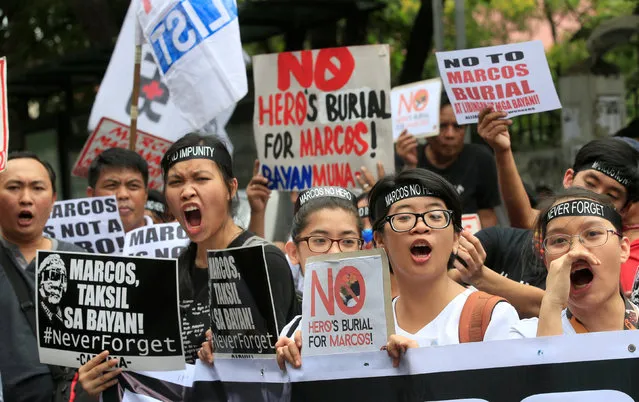 Protesters shout anti-Marcos slogans denouncing the burial of former Philippine dictator Ferdinand Marcos at the Libingan ng mga Bayani (heroes' cemetery), along a main street in Taft avenue, metro Manila, Philippines November 18, 2016. (Photo by Romeo Ranoco/Reuters)