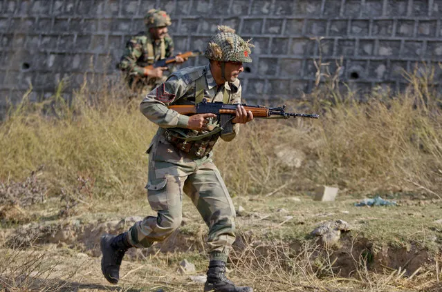 Indian army soldiers conduct a search operation in a forest area outside the Pathankot air force base in Pathankot, India, Sunday, January 3, 2016. (Photo by Channi Anand/AP Photo)