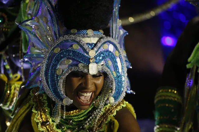 A performer from the Imperatriz Leopoldinense samba school parades during carnival celebrations at the Sambadrome in Rio de Janeiro, Brazil, Tuesday, February 17, 2015. (Photo by Leo Correa/AP Photo)