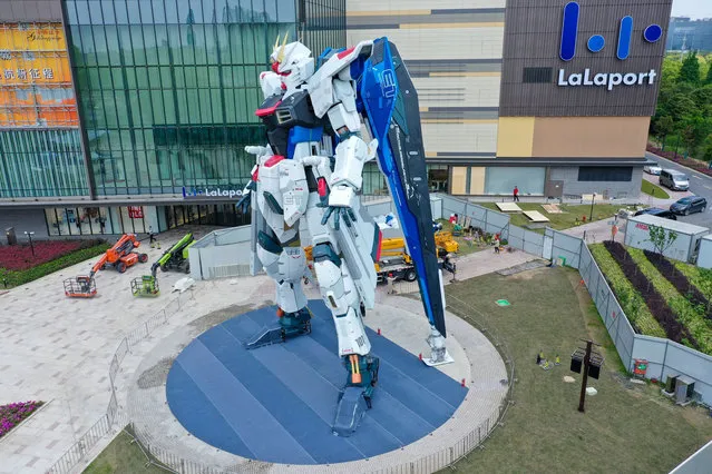 A 18.03-meter-high Freedom Gundam statue is on display at the Mitsui Shopping Park LaLaport on April 26, 2021 in Shanghai, China. The head of the life-size Freedom Gundam statue was installed successfully in Shanghai on Monday. (Photo by VCG/VCG via Getty Images)