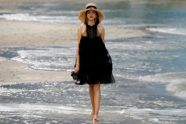 A model presents a creation by German designer Karl Lagerfeld as part of his Spring/Summer 2019 women's ready-to-wear collection show for fashion house Chanel at the Grand Palais transformed as a beach scene during Paris Fashion Week in Paris, France, October 2, 2018. (Photo by Stephane Mahe/Reuters)