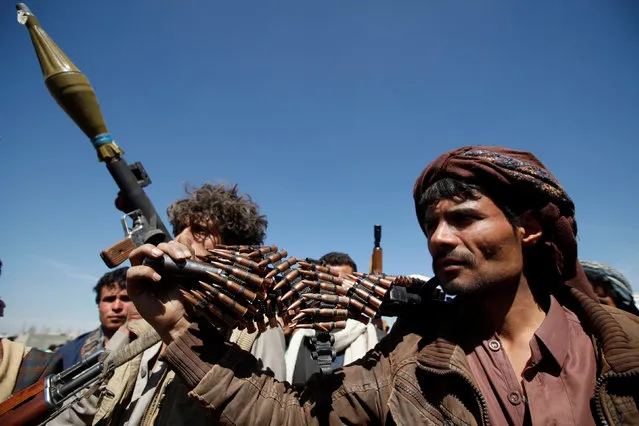 Pro-Houthi tribesmen carry their weapons during a gathering held to mobilize fighters for battles against government forces, in Sanaa, Yemen November 24, 2016. (Photo by Khaled Abdullah/Reuters)