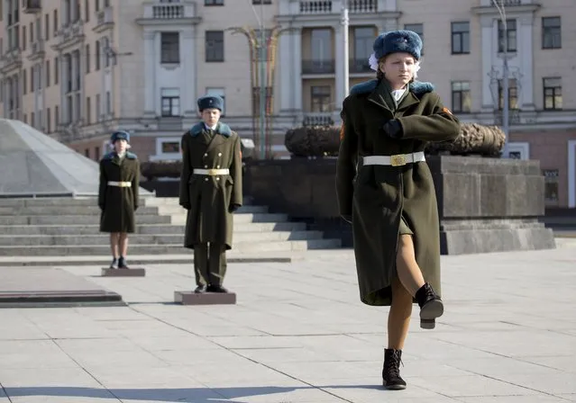 Belarussian students participate in an honour guard ceremony, which is part of a state patriotic action and preparations for the upcoming Victory Day celebrations, in Victory Square in Minsk, March 20, 2015. Belarus will mark the 70th anniversary of their victory over Nazi Germany on May 9 this year. (Photo by Vasily Fedosenko/Reuters)