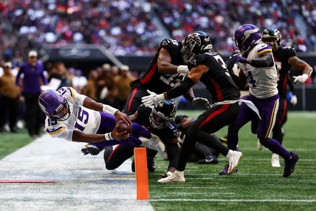 Joshua Dobbs #15 of the Minnesota Vikings reaches for the pylon during the second quarter of an NFL football game against the Atlanta Falcons at Mercedes-Benz Stadium on November 5, 2023 in Atlanta, Georgia. (Photo by Kevin Sabitus/Getty Images)