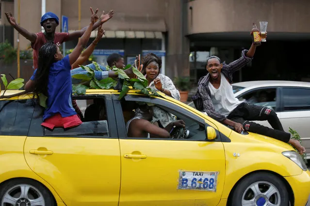 Supporters of Felix Tshisekedi, leader of the Congolese main opposition party, the Union for Democracy and Social Progress (UDPS) who was announced as the winner of the presidential elections celebrate in the streets of Kinshasa, Democratic Republic of Congo on January 10, 2019. (Photo by Baz Ratner/Reuters)