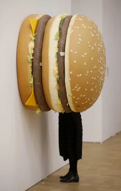 A woman watches a creation by Tom Friedman “Big Big Mac” during the unveiling of Arts & Food exhibition at the Triennale in Milan, Italy, Wednesday, April 8, 2015. The exhibition is part of the Expo 2015 in Milan, whose theme is “Feeding the Planet, Energy for Life”. (Photo by Luca Bruno/AP Photo)
