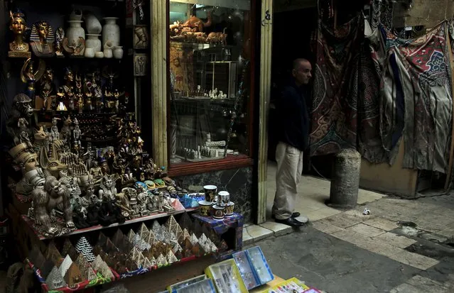 A shopkeeper waits for tourists in the Khan el-Khalili market, at al-Hussein and Al-Azhar districts in old Islamic Cairo, Egypt, November 12, 2015. (Photo by Amr Abdallah Dalsh/Reuters)