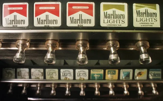 This Monday, Oct. 13, 1997 file photo shows a cigarette vending machine in a bar in Montpelier, Vt. A law passed by the Legislature banned all cigarette vending machines in the state as of August 28, 1997, but Vermont Attorney General William Sorrell ruled that enforcement of the law would begin in March 1998. (Photo by Toby Talbot/AP Photo)