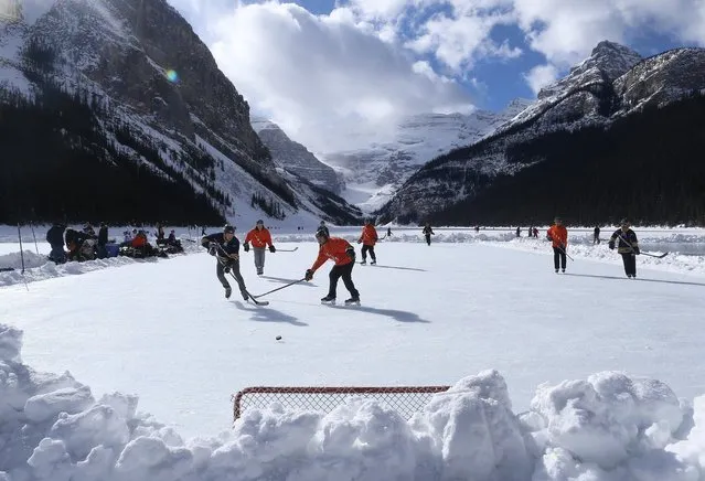Outdoor shinny hockey action during the 7th Annual Lake Louise Pond Hockey Classic on the frozen surface of Lake Louise on February 27, 2016 in Lake Louise, Alberta, Canada. (Photo by Tom Szczerbowski/Getty Images)