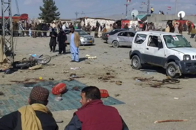 Security officials examine the scene of a bomb blast in Khanozai, Pashin, a district of Pakistan's Baluchistan province, Wednesday, February 7, 2024. A pair of bombings at the election offices of a political party and an independent candidate in southwest Pakistan killed some people and wounded more, officials said Wednesday, the day before parliamentary elections are to be held. (Photo by Shah Hussain/AP Photo)