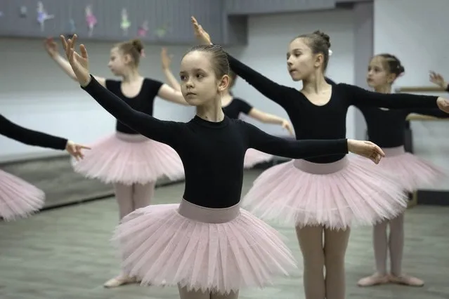 Girls practice in a ballet school in a bomb shelter in Kharkiv, Ukraine, Monday, March 18, 2024. Kharkiv, Ukraine's closest big city to the Russian border, is regularly under Russian missile attacks. (Photo by Efrem Lukatsky/AP Photo)