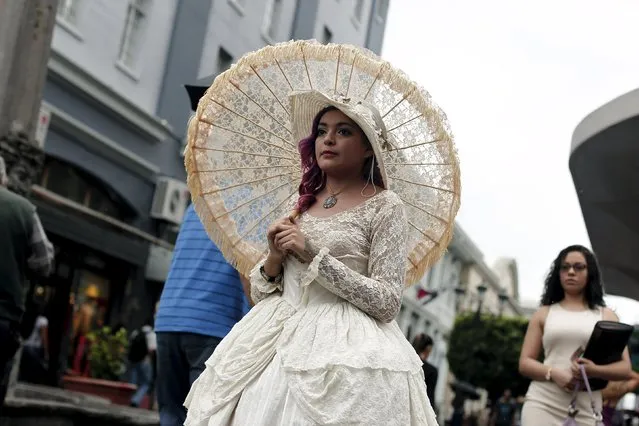 Adriana Barahona, known as " Madame Barocle," wearing clothing of the Victorian era, walks along a central avenue in San Jose, Costa Rica June 4, 2015. Barahona says she has been passionate about clothing from the era of Britain's Queen Victoria (1837-1901), and has been making and wearing them since the age of 15. REUTERS/Juan Carlos Ulate