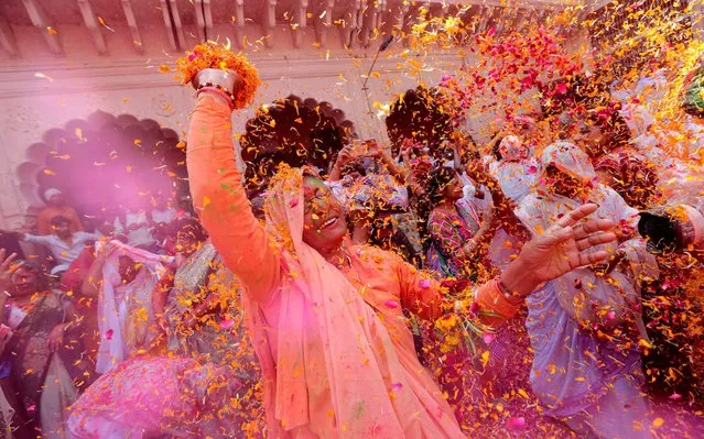 Indian widows participate in a celebration of the Holi festival in Vrindavan, Uttar Pradesh, India, 09 March 2017. Thousands of Hindu widows, shunned and ignored by their own families, marked the Hindu spring Festival of Colors in a event organized by Indian NGO Sulabh International. The Sulabh International tries to improve the condition of widows, who are living in government shelter homes, as in many parts of India widows are not allowed to celebrate Holi and participate in other festivals. (Photo by Harishh Tyagi/EPA)